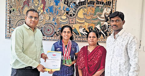 Nelakuditi Anusha with her parents.