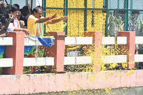 Irrigation Minister Nimmala Ramanaidu releases water into the Krishna Right Main Canal at Prakasam Barrage in Vijayawada on Wednesday