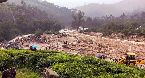 National Disaster Response Force (NDRF) personnel cooduct rescue operation after huge landslides in the hilly areas near Meppadi, in Wayanad district, Kerala.