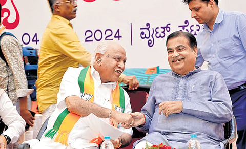 Former CM BS Yediyurappa and Union Minister Nitin Gadkari share a light moment at the BJP state executive committee meeting in Bengaluru on Thursday.