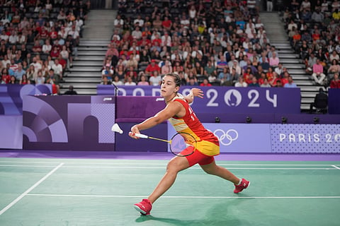 Spain's Carolina Marin plays against China's He Bingjiao during their women's singles badminton semifinal match at the 2024 Summer Olympics on Sunday