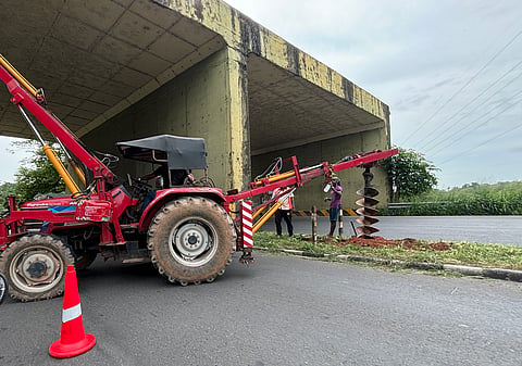 Drilling works to lay street lines in progress at the Container road