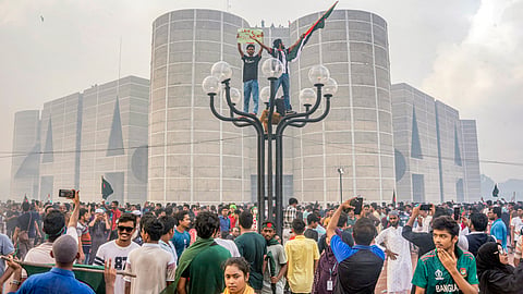 Protesters celebrate outside the parliament building after news of Prime Minister Sheikh Hasina's resignation, in Dhaka, Bangladesh, Monday, Aug. 5, 2024.
