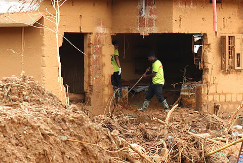Volunteers carry out searches at Chooralmala on the sixth day of rescue operations following the massive landslides in the area, in Wayanad.
