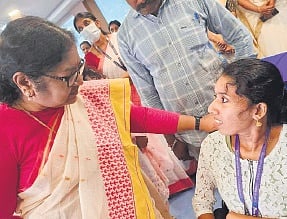 Hima Manukumar (R) narrating her plight to Minister R Bindu at Nava Kerala Sadas