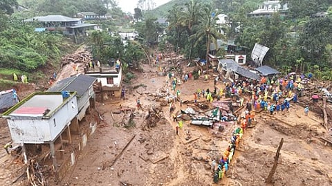 Rescue team is busy engaged in the rescue operation at the spot where a landslide occurred at Chooralmala in Wayanad district