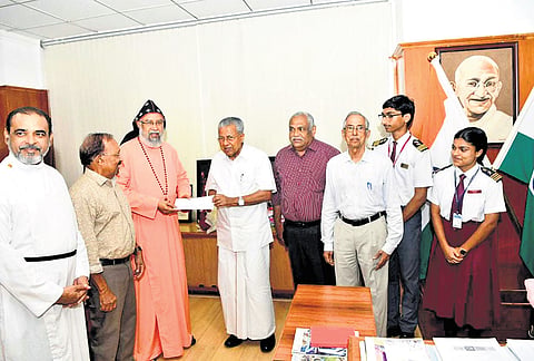 President of the Marthoma Church Educational Society, Isaac Mar Philoxenos, donates H10 lakh to the Chief Minister’s Distress Relief Fund on Tuesday