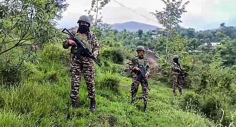 Security personnel conduct a search operation for a group of terrorists, in Basantgarh area of Udhampur district, Tuesday, Aug. 6, 2024.