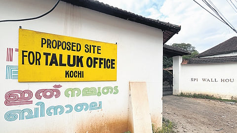 The state government has placed a board indicating the site of the proposed taluk office on the revenue land portion of Aspinwall House