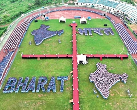 KISS students forming a human map of India and the word ‘Bharat’ in Hindi and English