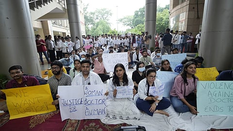 Medical students stage a protest against the sexual assault and murder of a postgraduate trainee doctor in Kolkata, at Ram Manohar Lohia Hospital, in New Delhi on Monday.