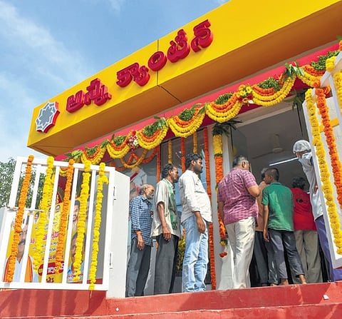 People standing in a queue at an Anna Canteen to get breakfast for Rs 5 in Vijayawada on Friday
