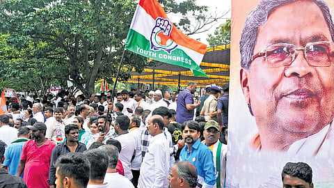 Congress workers protest against Governor Thaawarchand Gehlot for granting permission to prosecute CM Siddaramaiah in Bengaluru’s Freedom Park on Monday