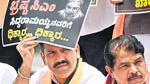 State BJP chief BY Vijayendra and LoP R Ashoka at the protest organised by the party on the premises of Vidhana Soudha on Monday