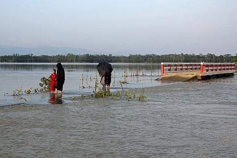 Floods triggered by torrential rains have swamped a swath of low-lying Bangladesh, disaster officials said Thursday.
