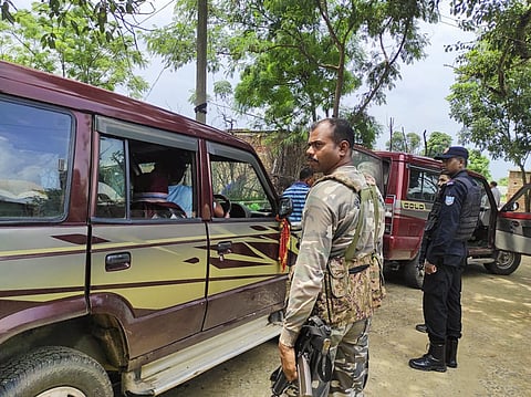 Security personnel outside the residence of a man allegedly linked to Al Qaeda, in Lohardaga district, Thursday, Aug. 22, 2024. Seven people allegedly linked to Al Qaeda were detained by Jharkhand Anti-Terrorist Squad (ATS) in raids in different parts of the state on Thursday.