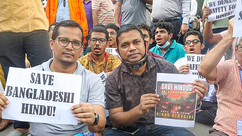 Bangladesh Hindu community members participate in a protest and block the Shahbagh intersection in Dhaka, Bangladesh