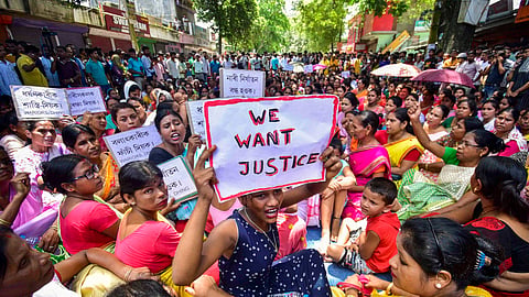 Locals protest against an alleged gang-rape of a 14-year-old girl by three men at Dhing area, in Nagaon district in Assam, Friday, Aug. 23, 2024.