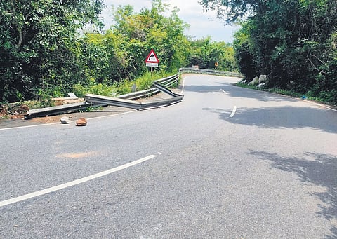 A damaged guardrail protrudes on the Mettupalayam-Kotagiri ghat road, endangering motorists