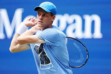Jannik Sinner of Italy returns the ball during a practice session prior to the start of the 2024 US Open