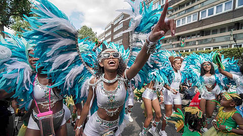 Participants taking part in the Children's Day Parade, part of the Notting Hill Carnival celebration in west London, Sunday.
