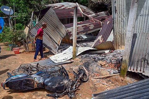 Houses demolished after violence that erupted following an alleged vandalisation of a Kali idol, in Ranirbazar area of west Tripura
