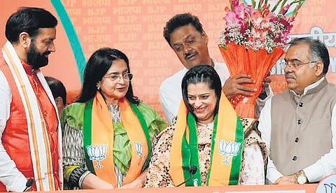 Chief Minister Nayab Singh Saini felicitates former Congress leaders Kiran Choudhry and her daughter Shruti Choudhry after joining BJP, in New Delhi.