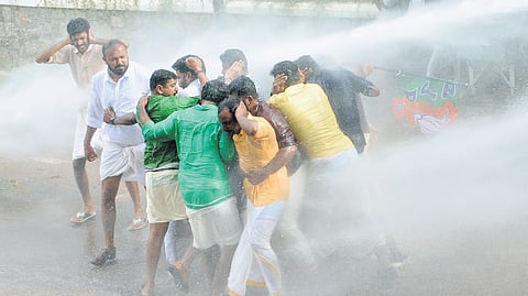Police used water cannons to disperse Yuva Morcha activists protesting in front of the Cliff House on Thursday demanding the resignation of M Mukesh MLA