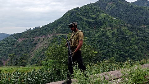 A security personnel keeps vigil during pre-dawn cordon and search operation after reports of suspicious movement, leading to an exchange of fire, in Rajouri district, Thursday, Aug 29, 2024.