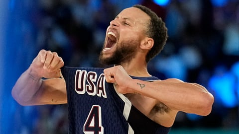United States' Stephen Curry (4) celebrates after beating France to win the gold medal during a men's gold medal basketball game at Bercy Arena at the 2024 Summer Olympics, Saturday, Aug. 10, 2024, in Paris, France.