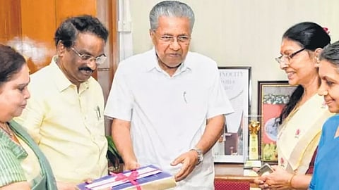 Kerala CM Pinarayi Vijayan receiving the report from Retired Justice K Hema