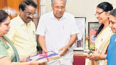 Kerala CM Pinarayi Vijayan receiving the report from Retired Justice K Hema
