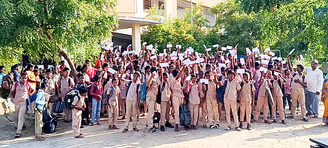 Samudrathottam Government high school students in Manapparai, Tiruchy posing with the letters they addressed to their parents.