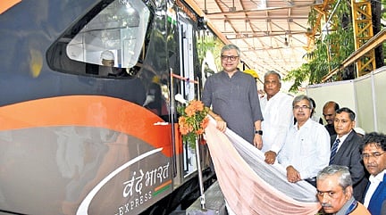 Union Railway Minister Ashwini Vaishnaw unveils the prototype of Vande Bharat sleeper train in Bengaluru on Sunday. Right: Berths in the sleeper coach