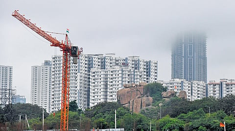 A cloud seen over high-rise buildings in Hyderabad on Monday