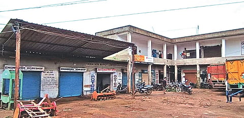 The double-storey market complex in Telkoi; (inset) Dharanidhar Nayak