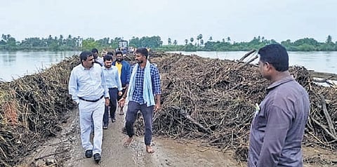 Bapatla District Collector J Venkata Murali inspecting the embankment repair works at Aravindavagu in Kollipara on Wednesday