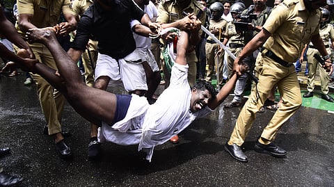Police arrest and forcefully remove Youth Congress workers taking out a protest march to the city police commissioner’s office in Kochi on Wednesday against the state government for allegedly shielding criminals in uniform.