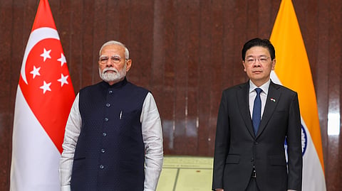 Prime Minister Narendra Modi with his Singapore counterpart Lawrence Wong during a ceremonial welcome, in Singapore.