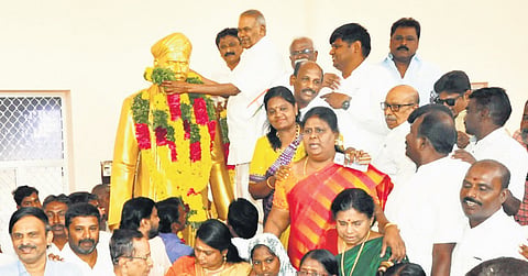 Assembly Speaker M Appavu garlanding the statue of freedom fighter VO Chidambaram on his 153rd birth anniversary in Tirunelveli