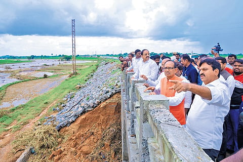 Union Minister Shivraj Singh Chouhan examines damages at Palair in Khammam district on Friday