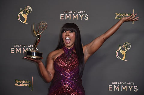 Angela Bassett poses with her award for outstanding narrator for "Queens" on night one of the Creative Arts Emmy Awards on Saturday, Sept. 7, 2024, in Los Angeles.