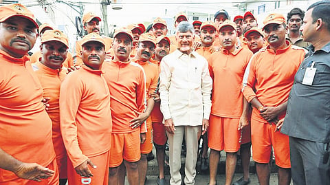 CM N Chandrababu Naidu along with NDRF personnel in Vijayawada.