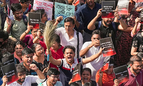 Junior doctors shout slogans during their protest march in Kolkata