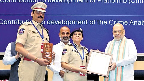 Union Home Minister Amit Shah gives award to Director of Telangana Cyber Security Bureau Shikha Goel and SP Devender Singh in New Delhi on Tuesday