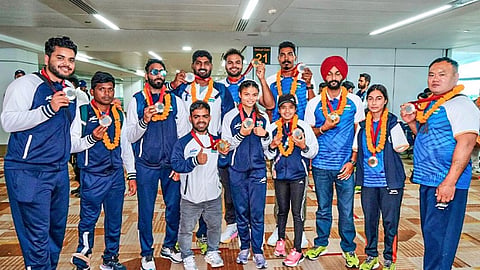 Swarmed by hundreds of supporters, garlanded and offered sweets, India’s Paralympic medal-winners returned to a jubilant welcome on Tuesday.