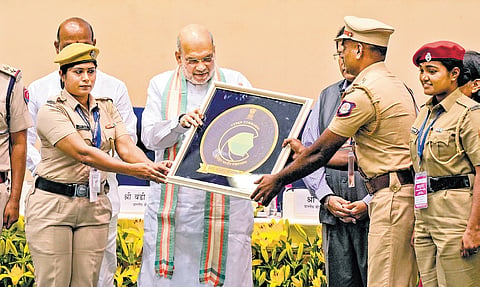 Home Minister Amit Shah presents certificate of recognition to cyber commandos during the 1st foundation day celebration of I4C, in New Delhi on Tuesday.
