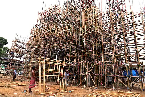 Contraction work of Durga puja pandal under progress at Rasulgarh puja ground in Bhubaneswar on Thursday