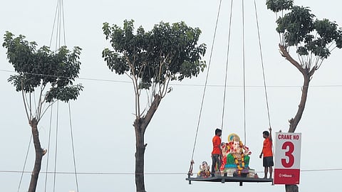 A Ganesh idol being immersed at People’s Plaza in Hyderabad
on Wednesday