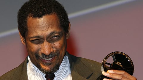 US writer Percival Everett holds his trophy after he was awarded with the Literary Award at the 38th American Film Festival Sept. 5, 2012, in Deauville, Normandy, France.